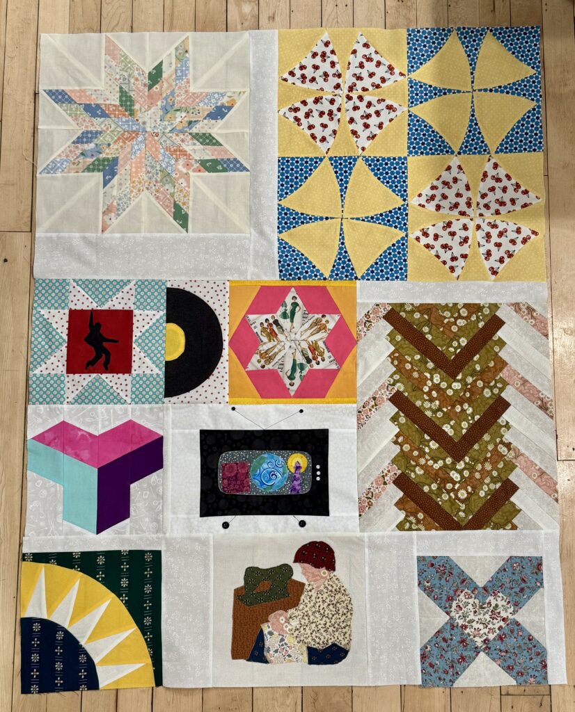 An eclectic quilt with blocks based on decades from the 1930s to the 2010s. 